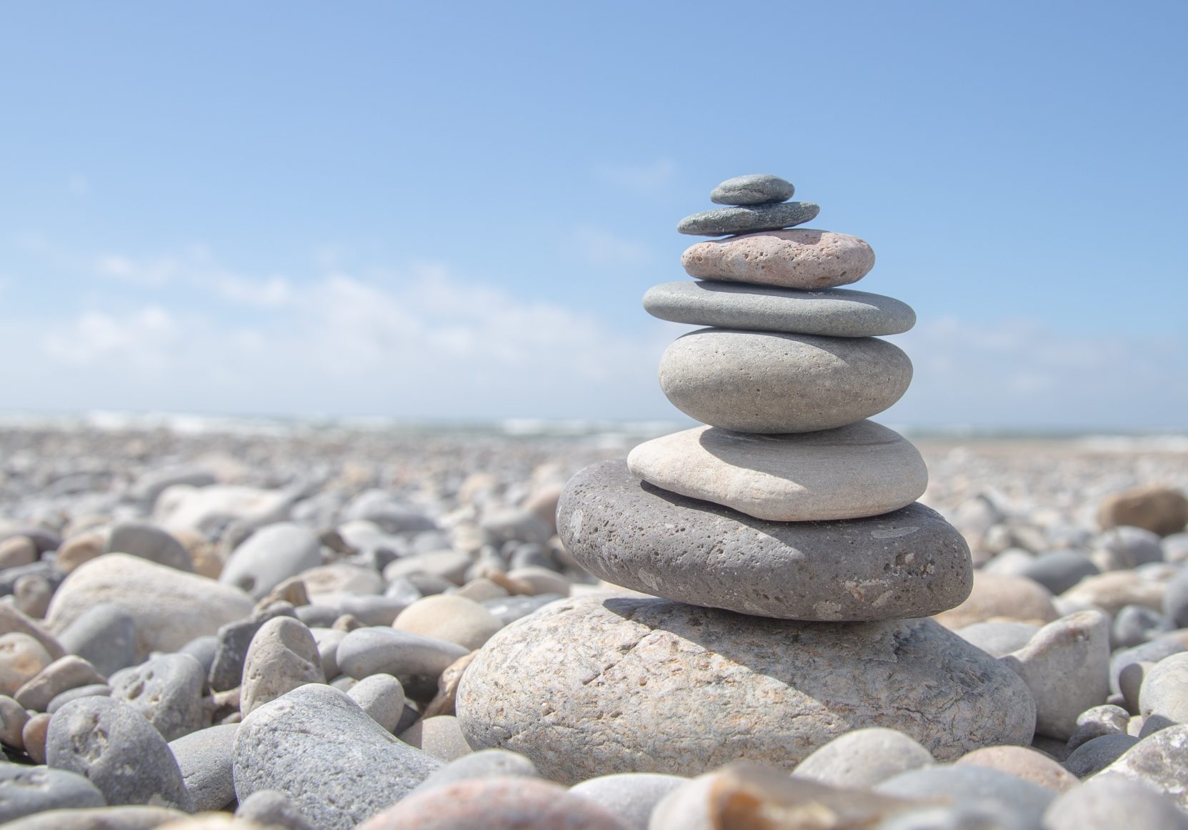 A beautiful shot of a stack of rocks on the beach - business stability concept